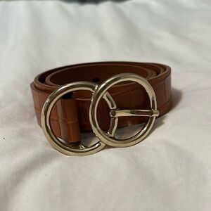 Brown croc belt. Fits a 31” waist in middle hole